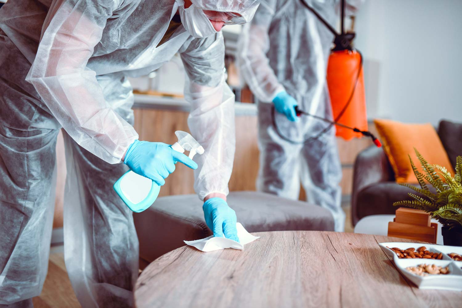 Two technicians performing biohazard cleanup