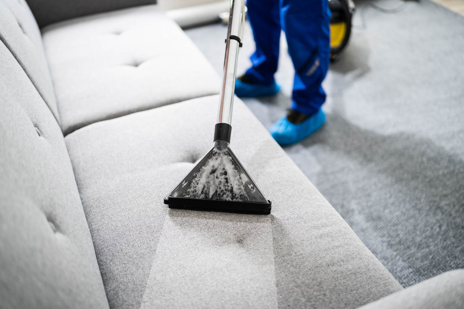 Technician Performing Couch Cleaning Service in Long Island